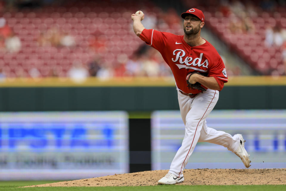 Cincinnati Reds' Hunter Strickland throws during the ninth inning of a baseball game against the St. Louis Cardinals in Cincinnati, Sunday, July 24, 2022. (AP Photo/Aaron Doster)