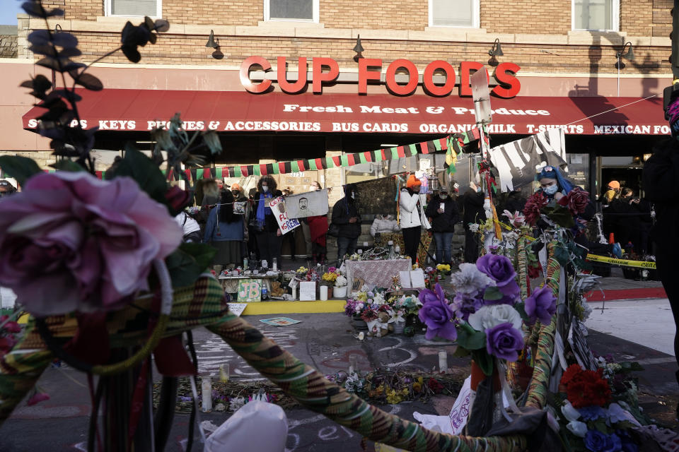 People gather at Cup Foods after a guilty verdict was announced at the trial of former Minneapolis police Officer Derek Chauvin for the 2020 death of George Floyd, Tuesday, April 20, 2021, in Minneapolis, Minn. Former Minneapolis police Officer Derek Chauvin has been convicted of murder and manslaughter in the death of Floyd. (AP Photo/Morry Gash)