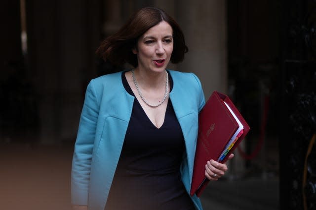 Education Secretary Bridget Phillipson carries a folder as she walks down the street