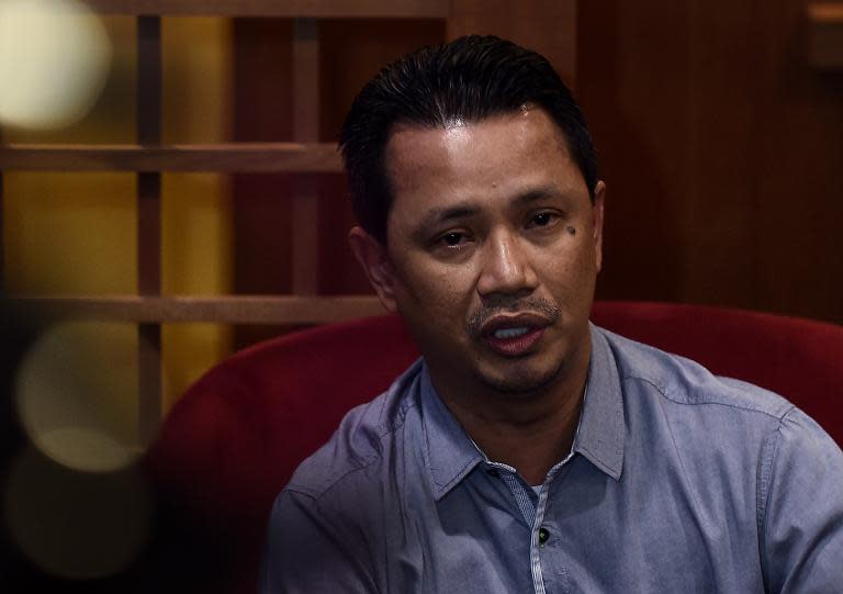 Malaysia's chef de mission, Norza Zakaria, speaks during a press conference in Kuala Lumpur, in November 2014