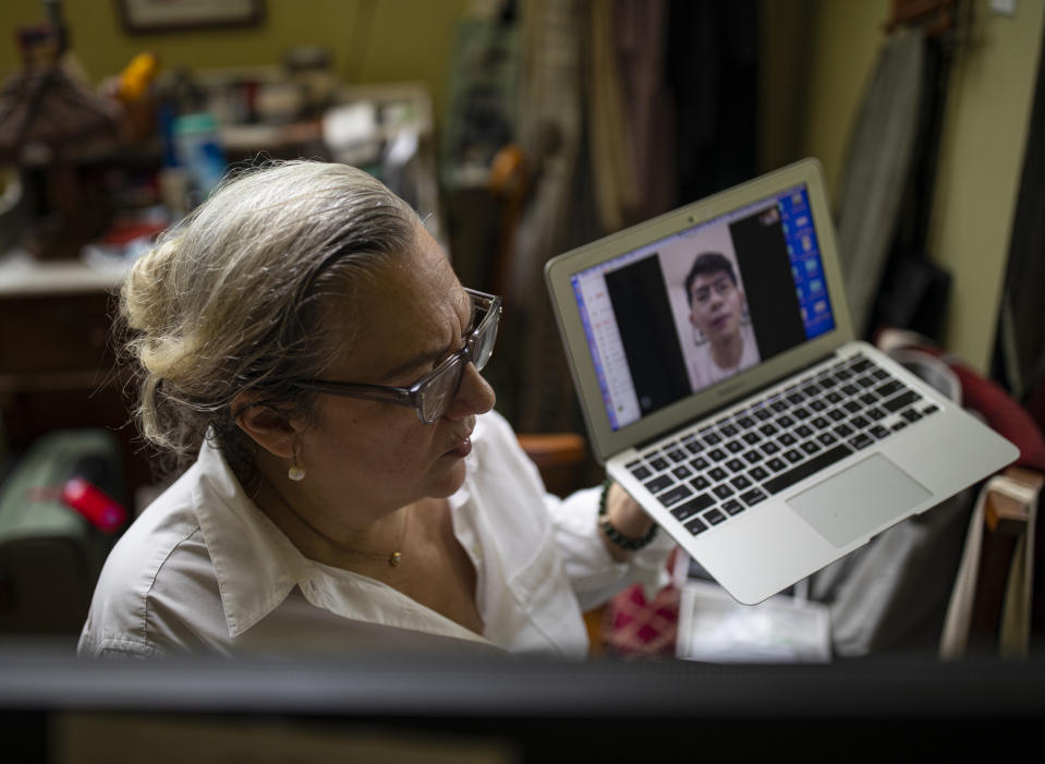 NEW YORK, NY - MAY 29: Associate Professor Carol Dysinger, right, of New York University's Tisch School of the Arts, conducts her final remote office hour for the graduate school's filmmaking students May 29, 2020 at her apartment in the Brooklyn borough of New York City. Due to coronavirus, Dysinger's Taiwanese student, Tsung Yen Lin, returned home to Taipei and is finalizing a 13-minute film about a young Taiwanese married couple.  NYU moved to holding remote learning classes in mid-March due to the coronavirus epidemic that closed campuses for the spring semester. NYU uses its own security protected Zoom channel. Dysinger was awarded an Academy Award in the Best Documentary (Short Subject) category for Learning to Skateboard in a Warzone (If You're a Girl) at the 92nd annual Academy Awards in Los Angeles on February 9, 2020. (Photo by Robert Nickelsberg/Getty Images)