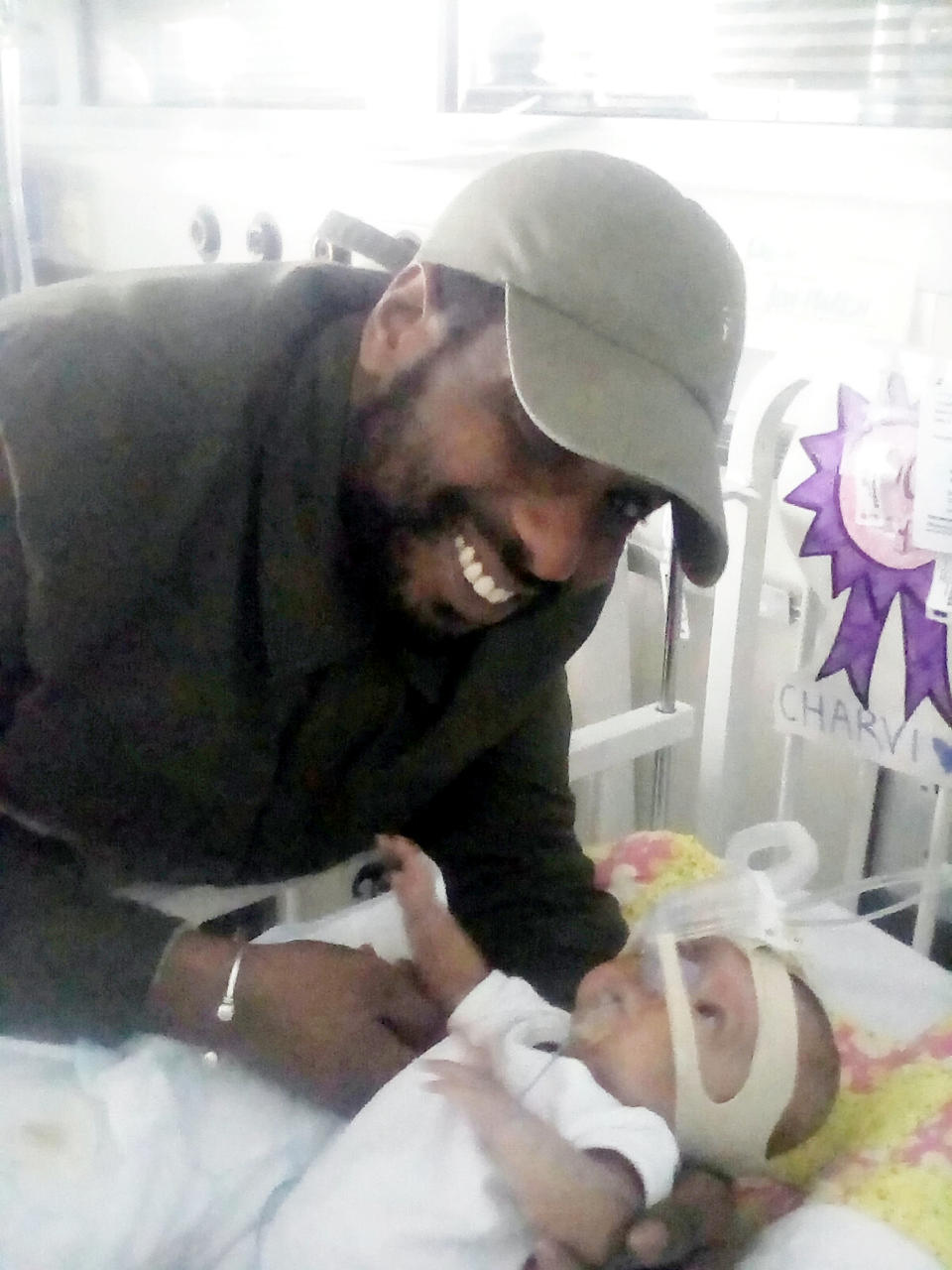 Daniel visits Charvi at St Thomas' Hospital. (SWNS)