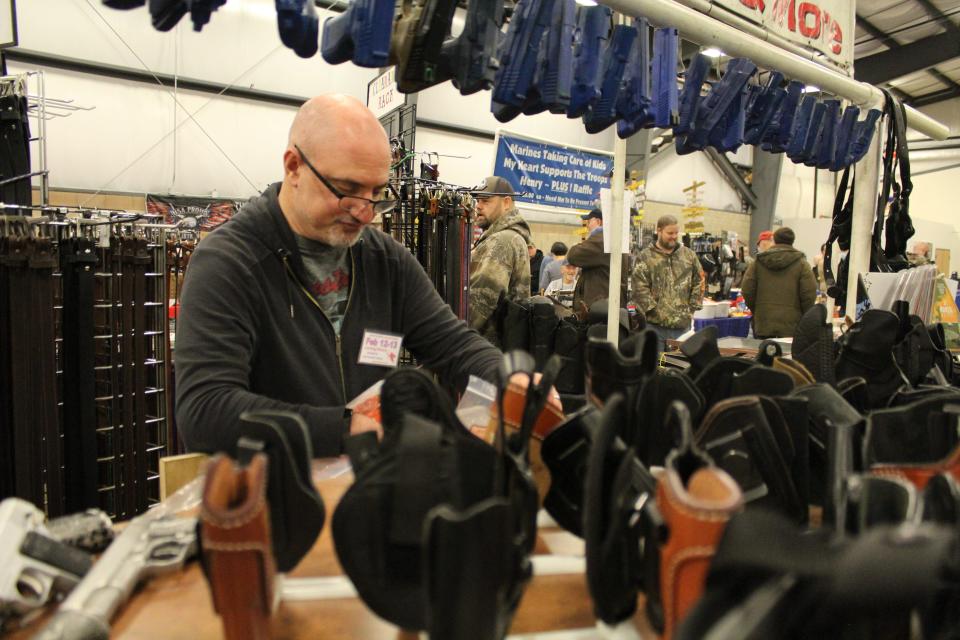 At the Monroe Gun & Knife Show at the Monroe County Fairgrounds, Howard Keller of Westland, a vendor for 19 years, had an extensive corner booth with leather belts and holsters for sale. Provided by Kennedy Bowling