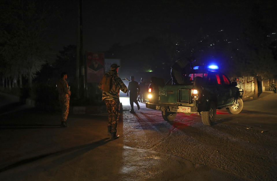 Afghan police work at the site of an attack at Kabul University in Kabul, Afghanistan, Monday, Nov. 2, 2020. The brazen attack by gunmen who stormed the Kabul University has left many dead and wounded in the Afghan capital. The assault sparked a hours-long gunbattle. (AP Photo/Rahmat Gul)