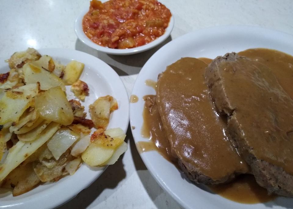 Meatloaf is served with home fries and hot rice at Fa-Ray’s Family Restaurant in Barberton.
