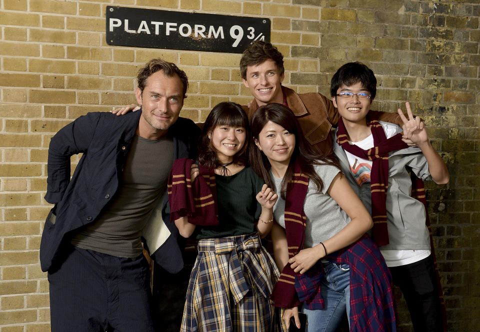 LONDON, ENGLAND - SEPTEMBER 01:  Eddie Redmayne (R) and Jude Law (L), stars of Fantastic Beasts: The Crimes Of Grindelwald, surprise fans at platform 9 3/4 during 'Back to Hogwarts' day celebration at Kings Cross Station on September 1, 2018 in London, England.  (Photo by Jeff Spicer/Getty Images for Warner Bros)