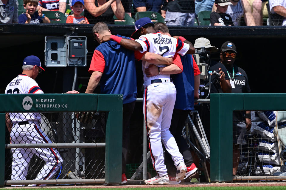 CHICAGO, ILLINOIS - MAY 29: Tim Anderson #7 of the Chicago White Sox is helped off the field by medical staff after an apparent injury in the fifth inning against the Chicago Cubs at Guaranteed Rate Field on May 29, 2022 in Chicago, Illinois. (Photo by Quinn Harris/Getty Images)