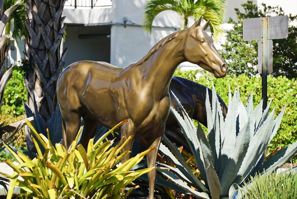 Horse statues line the roundabouts at Boynton Town Center.