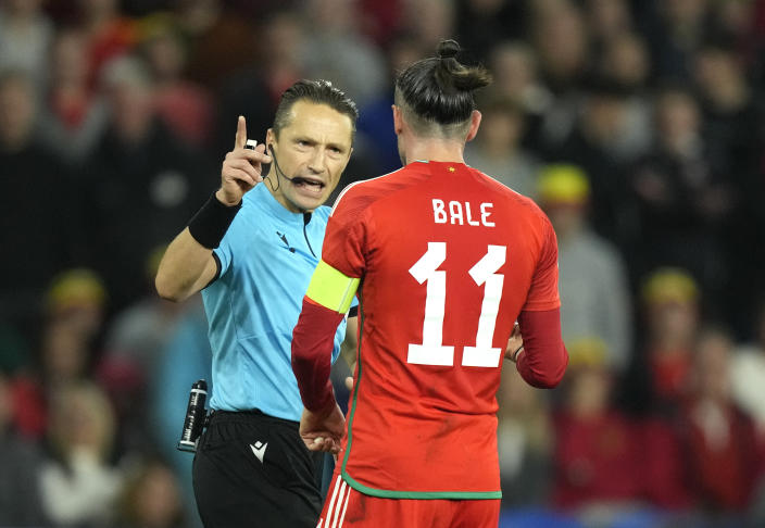 Wales' Gareth Bale argues with referee Andris Treimanis during the UEFA Nations League soccer match between Wales and Poland at the Cardiff City Stadium in Cardiff, Wales, Sunday, Sept. 25, 2022. (AP Photo/Frank Augstein)