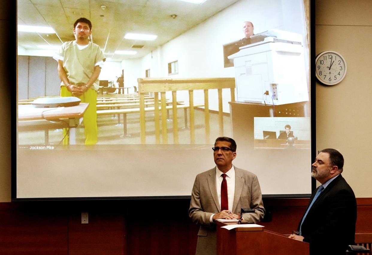 Gerson Fuentes, 27, accused of raping a 10-year-old girl who traveled to Indiana for an abortion, was arraigned via secure video conference Monday at Franklin County Common Pleas Court. He entered not guilty pleas to two counts of rape levied by a Franklin County grand jury. Interpreter Wolfgang Salazar, left, and Fuentes' defense attorney, Bryan Bowen, right, listen to  Magistrate Pamela Broer Browning during the arraignment.