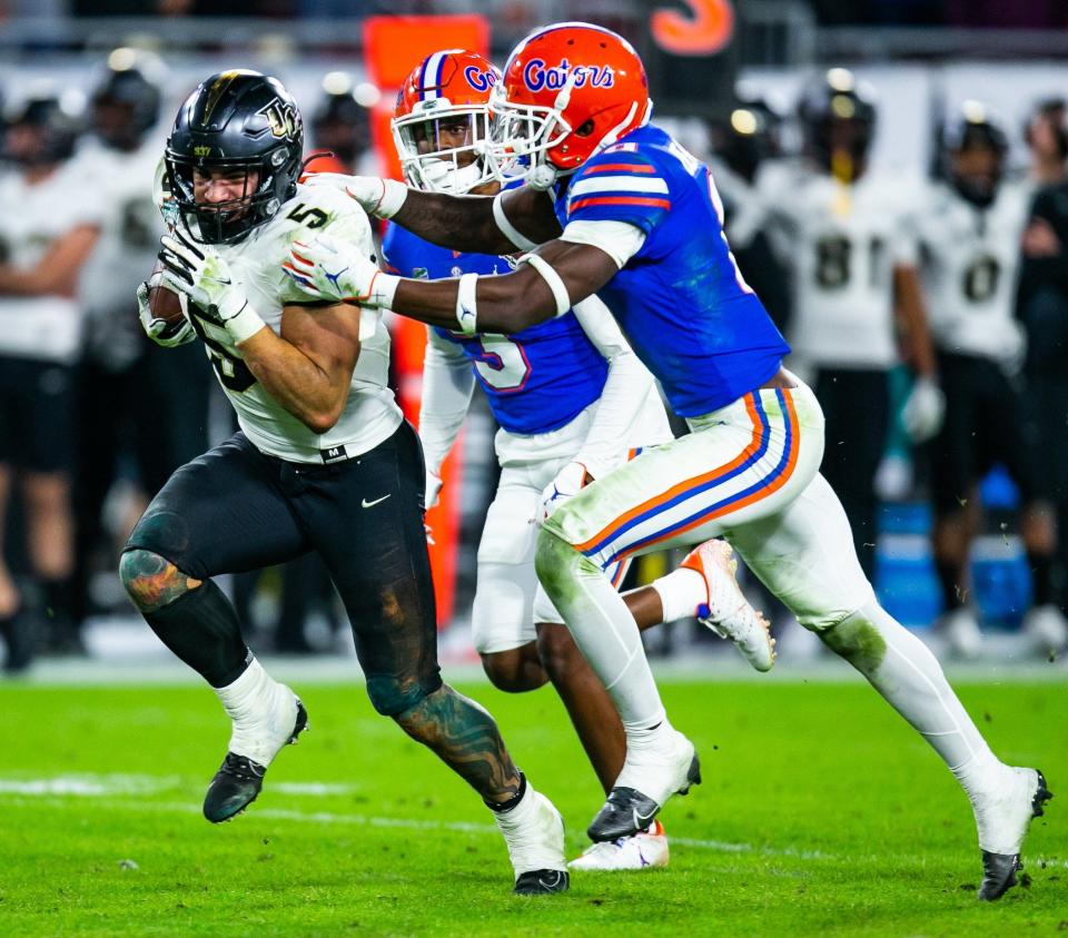 UCF running back Isaiah Bowser (5) pounded the Florida Gators' defense for 155 yards rushing in Thursday's 29-17 victory in the Gasparilla Bowl, sending a message to the rest of the state that the Knights may be ready to be an equal to the state's Big Three college football programs.
