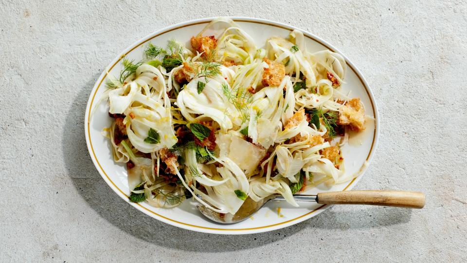 If you're making a fennel salad, mix the fronds right in there too.