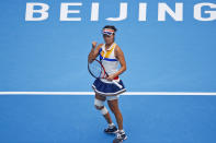 FILE - Peng Shuai of China reacts after scoring a point against Monica Niculescu of Romania during their women's singles match of the China Open tennis tournament at the Diamond Court in Beijing, Wednesday, Oct. 4, 2017. The head of the women’s professional tennis tour announced Wednesday, Dec. 1, 2021, that all WTA tournaments would be suspended in China because of concerns about the safety of Peng Shuai, a Grand Slam doubles champion who accused a former high-ranking government official in that country of sexual assault.(AP Photo/Andy Wong, File)
