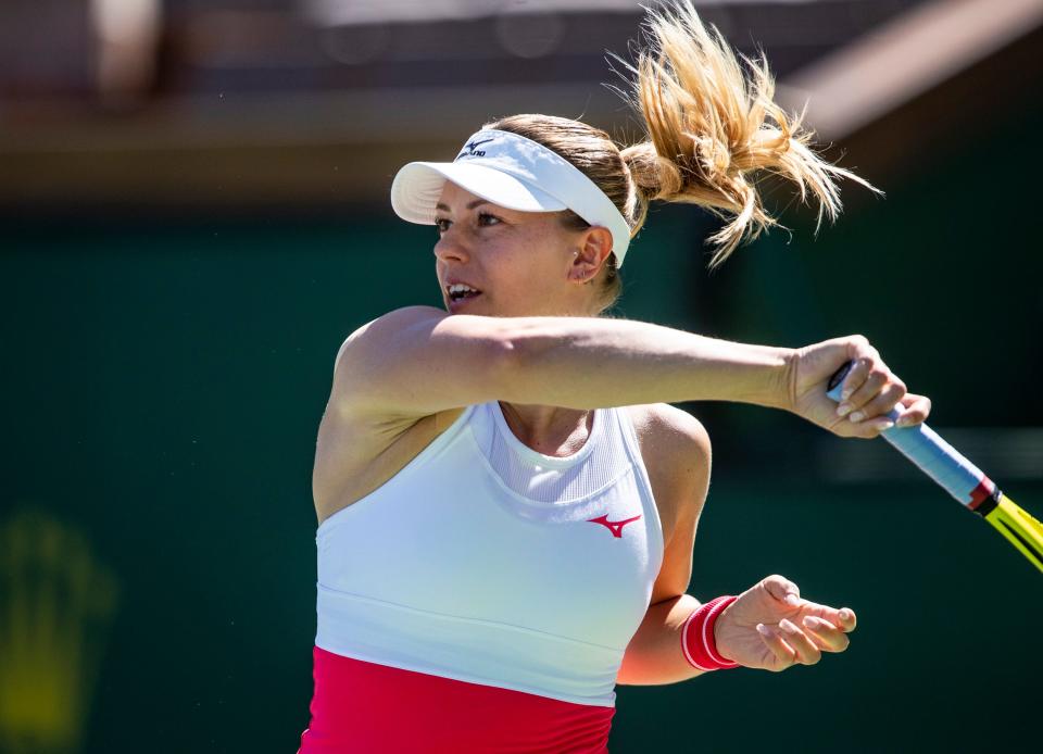 Dalma Galfi of Hungary returns to Danielle Collins of the United States during their round one match in the BNP Paribas Open at the Indian Wells Tennis Garden in Indian Wells, Calif., Thursday, March 9, 2023. 