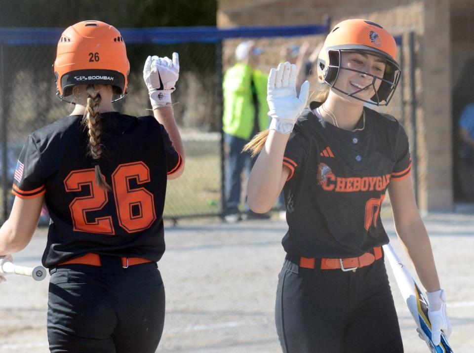 Cheboygan juniors Marley Couture (26) and Libby VanFleet (00) celebrate during a recent game against Petoskey on the road. Both Couture and VanFleet are Cheboygan area softball players to watch this spring.