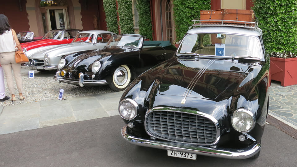 A Ferrari 212 Inter, with rare roof rack option. Behind it is a 1953 Porsche 356 Pre-A