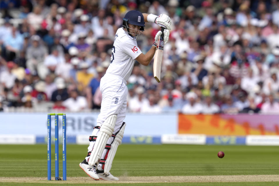 England's Joe Root plays a shot off the bowling of New Zealand's Tim Southee during the third day of the test match between England and New Zealand at Lord's cricket ground in London, Saturday, June 4, 2022. (AP Photo/Kirsty Wigglesworth)