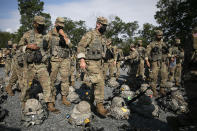 Cadets wear masks during training, Friday, Aug. 7, 2020, in West Point, N.Y. The pandemic is not stopping summer training at the U.S. Military Academy. (AP Photo/Mark Lennihan)