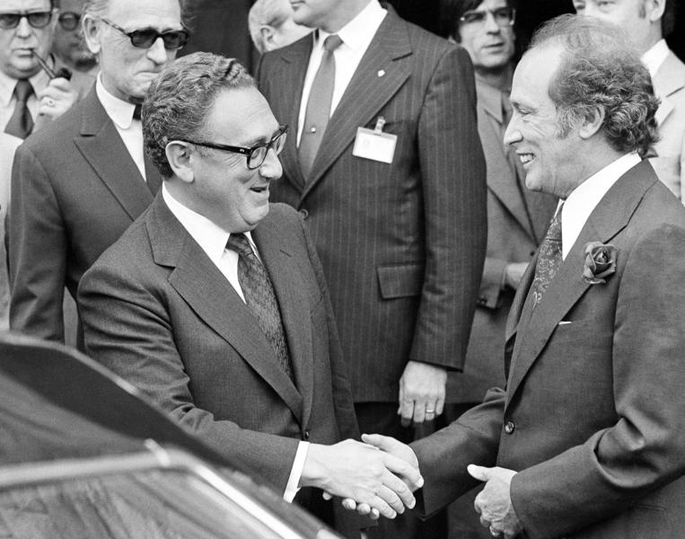 Pierre Trudeau (right), seen here greeting U.S. Secretary of State Henry Kissinger in 1974, governed Canada as part of a minority government in the early 1970s. His son Justin may find himself in a similar situation.