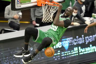 Boston Celtics center Tacko Fall (99) dunks during the fourth quarter of an NBA basketball game against the Orlando Magic, Friday, Jan. 15, 2021, in Boston. (AP Photo/Elise Amendola)