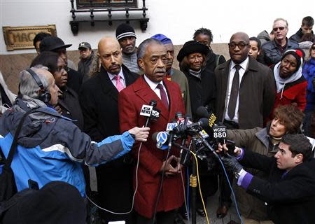 Rev. Al Sharpton speaks to the media outside Macy's department store, after meeting with company officials in New York, November 4, 2013. REUTERS/Adam Hunger