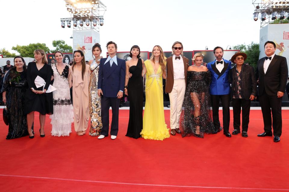 VENICE, ITALY - SEPTEMBER 05: (L-R) Arianne Phillips, a guest, Katie Silberman, Miri Yoon, Gemma Chan, Harry Styles, Sydney Chandler, director Olivia Wilde, Chris Pine, Florence Pugh, Nick Kroll, Matthew Libatique and Roy Lee attend the "Don't Worry Darling" red carpet at the 79th Venice International Film Festival on September 05, 2022 in Venice, Italy. (Photo by Vittorio Zunino Celotto/Getty Images)