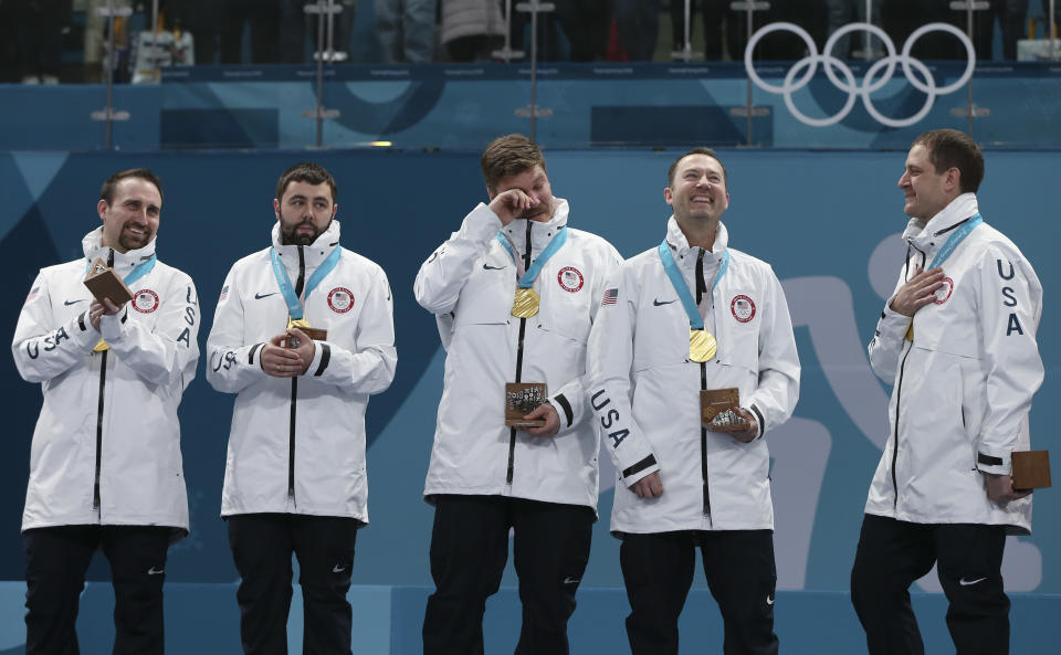 Gold medal winners from left: United States’ curlers Joe Polo, John Landsteiner, Matt Hamilton, Tyler George, John Shuster and captain Phill Drobnick stand on the podium during the men’s curling venue ceremony at the 2018 Winter Olympics in Gangneung, South Korea, Saturday, Feb. 24, 2018. (AP Photo/Natacha Pisarenko)