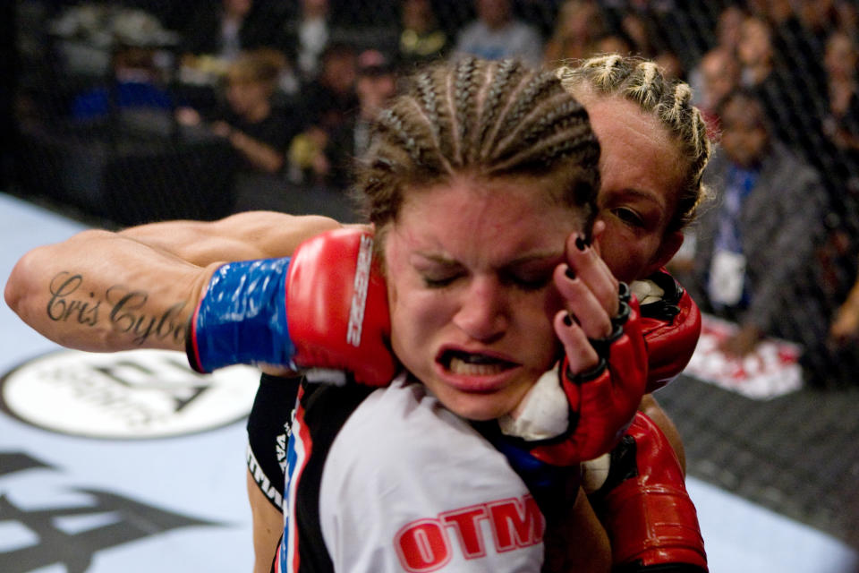 SAN JOSE, CA - AUGUST 15:  Cristiane 'Cyborg' Santos (R) punches Gina Carano during the inaugural Strikeforce Women's Championship event at HP Pavilion on August 15, 2009 in San Jose, California. (Photo by Esther Lin/Forza LLC/Forza LLC via Getty Images) 