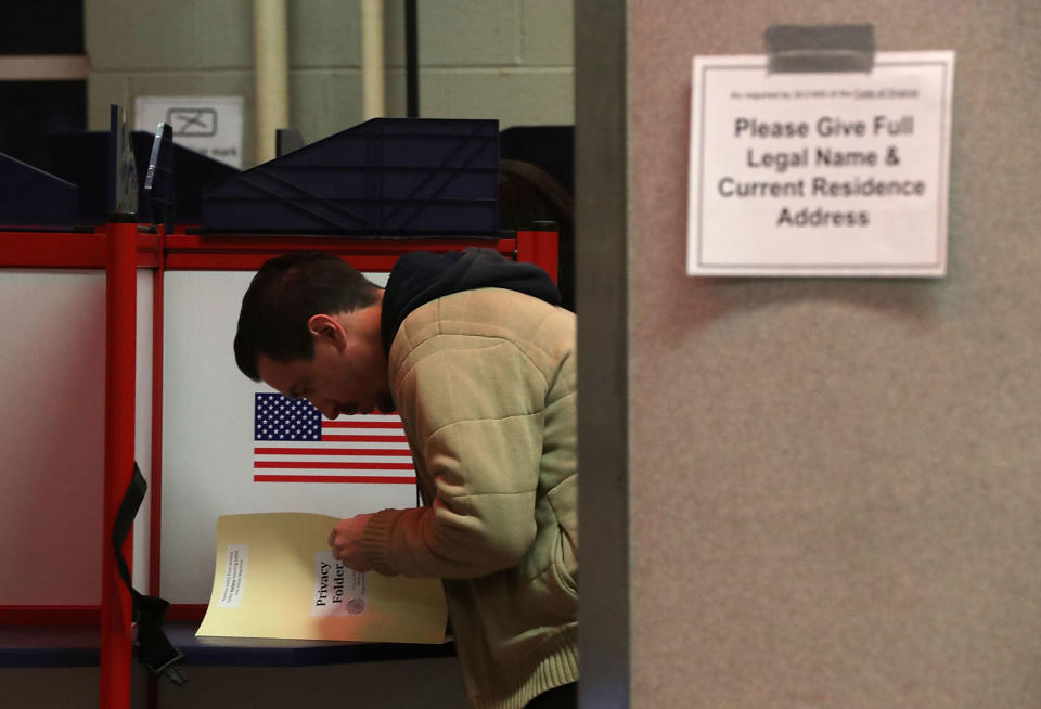 A voter casts his ballot in Alexandria, Va.
