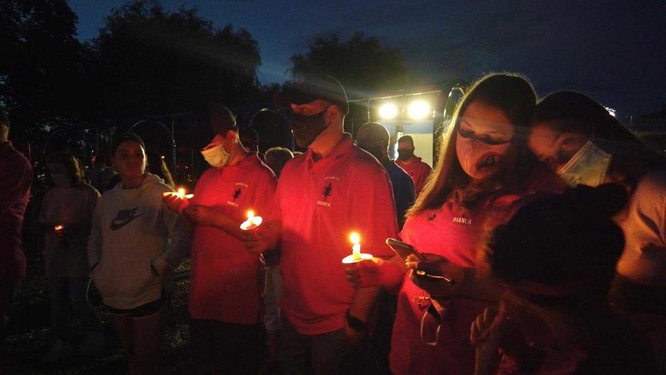 Family members and friends attend a candlelight vigil in memory of Bianca. 