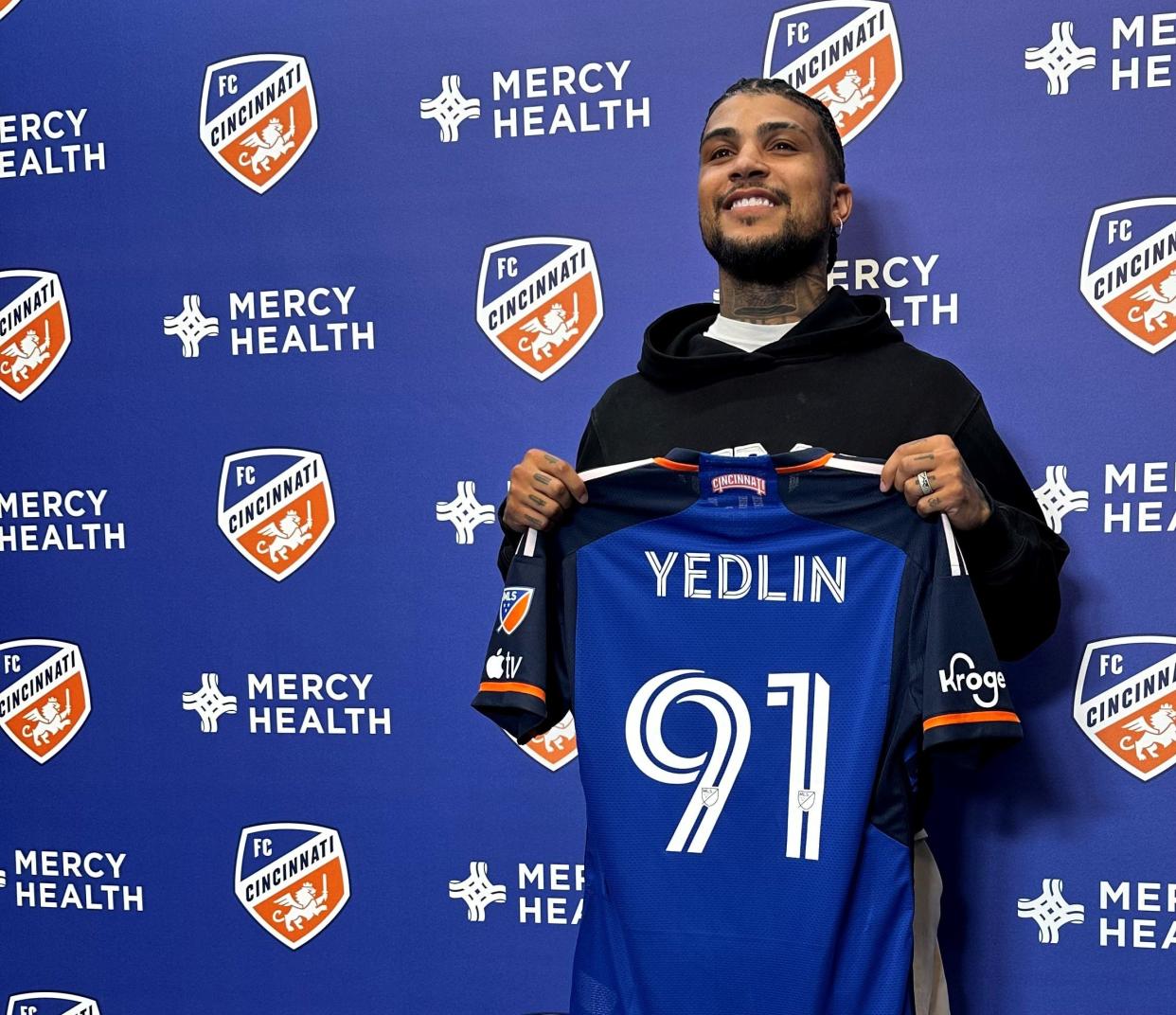 Newly-acquired defender DeAndre Yedlin (91) is introduced as an FC Cincinnati player during a March 5, 2024 news conference at the Mercy Health Training Center in Milford.