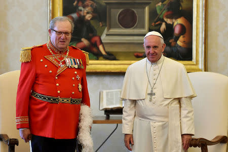 Pope Francis (R) meets Robert Matthew Festing, Prince and Grand Master of the Sovereign Order of Malta during a private audience at the Vatican June 23, 2016. REUTERS/Gabriel Bouys/Pool/File Photo