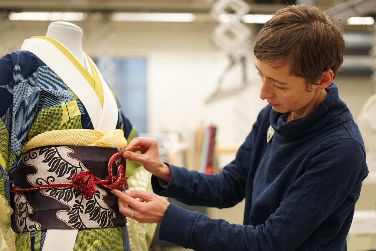 Secrets of the Museum S2 - Gesa Werner tying an obijime around the Wafrica Kimono by Serge Mouangue. (BBC/Blast! Films/Simon Lloyd)