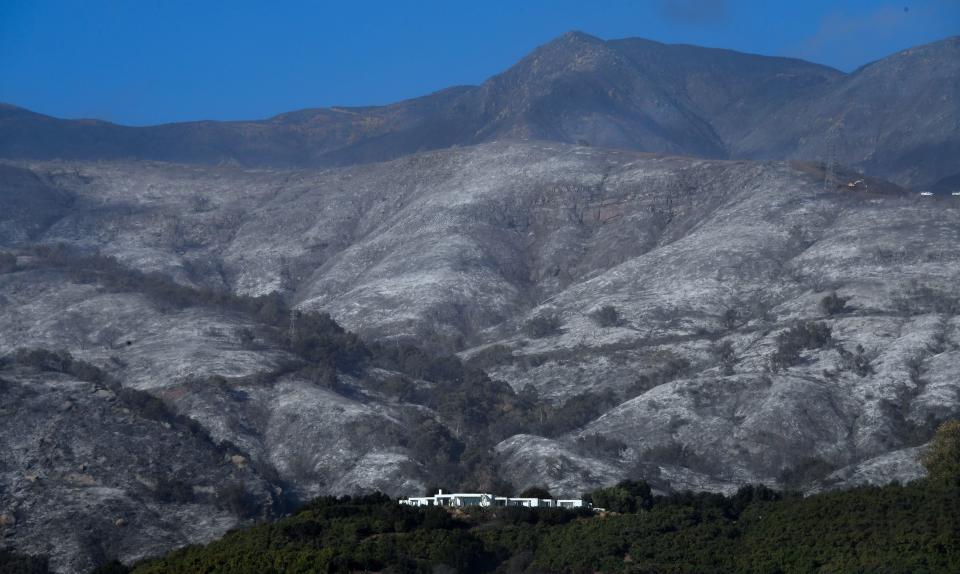 A house remains standing in front of an ash-filled hillside in Montecito, California, on Dec. 20. (Photo: FREDERIC J. BROWN via Getty Images)