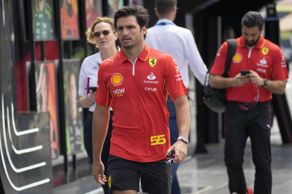 Ferrari driver Carlos Sainz of Spain arrives to the paddock ahead of the Formula One Saudi Arabian Grand Prix at the Jeddah Corniche Circuit in Jeddah, Saudi Arabia, Wednesday, March 6, 2024. Saudi Arabian Grand Prix will be held on Saturday, March 9, 2024. (AP Photo/Darko Bandic)