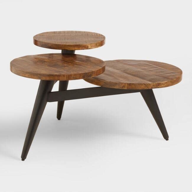 The <a href="https://www.worldmarket.com/product/wood+and+metal+multi+level+coffee+table.do?sortby=ourPicks&amp;from=fn" target="_blank">multi-level functionality of this coffee table</a> adds layers to your space and provides extra storage without taking up more space in width.