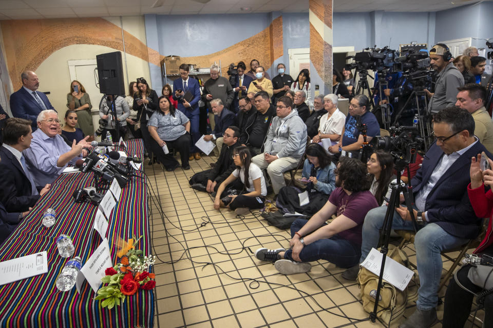 Ruben Garcia, second from left, founder and director of Annunciation House, a network of migrants shelters in El Paso, Texas, speaks during a news conference, Friday, Feb. 23, 2024. Garcia is reacting to the lawsuit filed by Texas Attorney General Ken Paxton that claims the Annunciation House "appears to be engaged in the business of human smuggling" and is threatening to terminate the nonprofit's right to operate in Texas. (AP Photo/Andres Leighton)