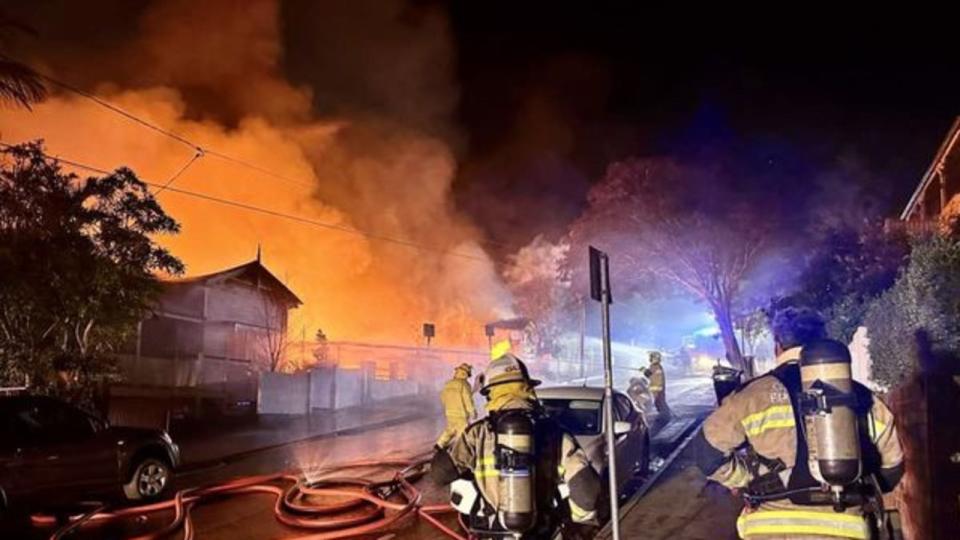 Multiple Ambulance crews are on standby to assist Queensland Fire and Emergency Services - QFES at a major fire  involving several properties in the Brisbane suburb of Woolloongabba. Picture: QAS via NCA NewsWire