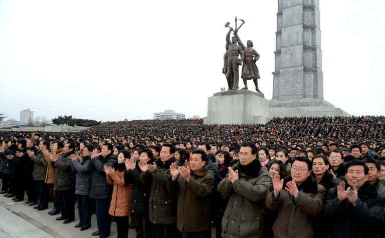 North Koreans celebrating a report on a rocket launch in Pyongyang