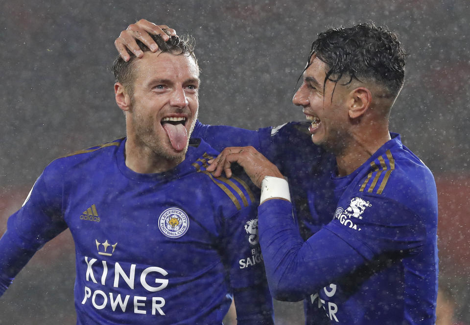 Leicester's Jamie Vardy, left, celebrates with Ayoze Perez after scoring his side's fifth goal during the English Premier League soccer match between Southampton and Leicester City at St Mary's stadium in Southampton, England Friday, Oct., 25, 2019. (AP Photo/Alastair Grant)