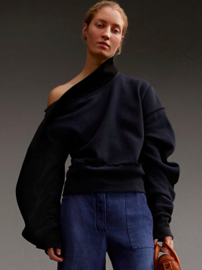 Asymmetric jumper with sculptural sleeves