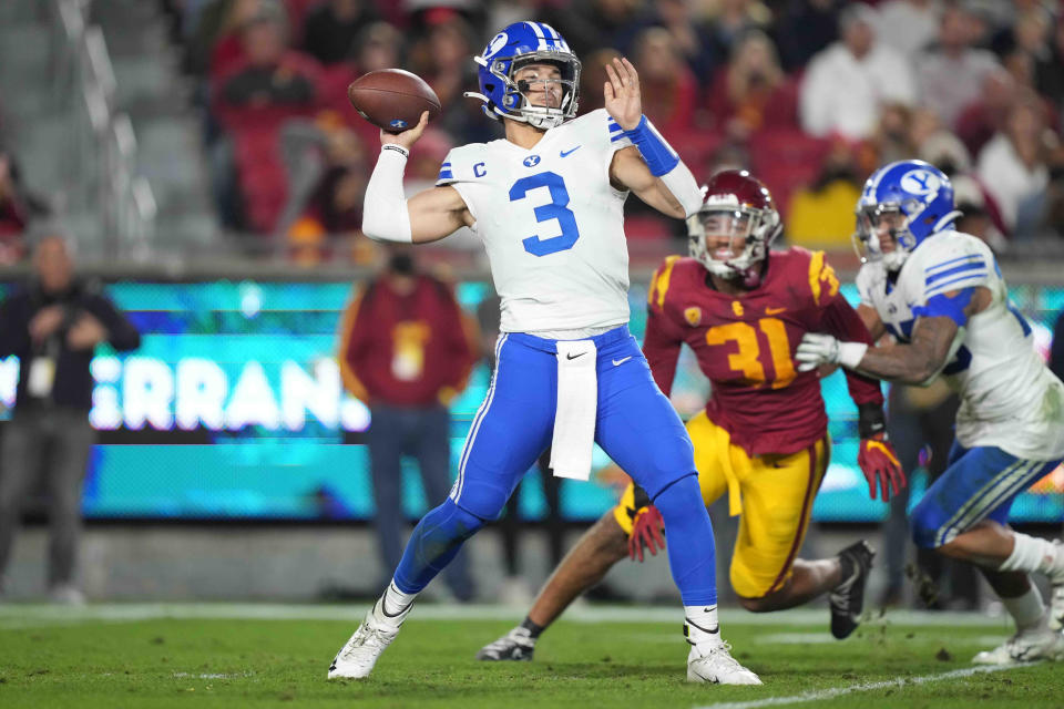 Nov. 27, 2021; Los Angeles, California; BYU Cougars quarterback <a class="link " href="https://sports.yahoo.com/nfl/players/40185" data-i13n="sec:content-canvas;subsec:anchor_text;elm:context_link" data-ylk="slk:Jaren Hall;sec:content-canvas;subsec:anchor_text;elm:context_link;itc:0">Jaren Hall</a> (3) throws the ball against the Southern California Trojans in the first half at United Airlines Field at Los Angeles Memorial Coliseum. Kirby Lee-USA TODAY Sports