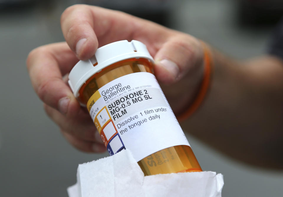 FILE - Newly-released inmate George Ballentine holds his prescription medicine Suboxone outside a pharmacy on July 23, 2018, in Greenfield, Mass. As the Oregon Legislature considers overhauling the state's pioneering drug decriminalization law, a bipartisan group of lawmakers are pushing for more funding for medications used to treat opioid addiction in jails. (AP Photo/Elise Amendola)
