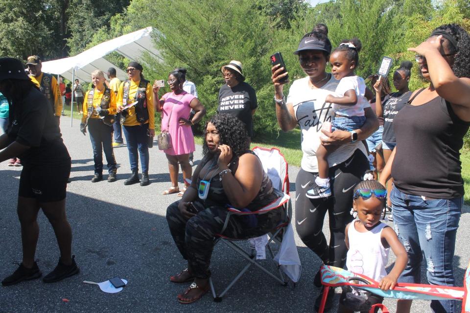 DaySpring Baptist Church in NE Gainesville hosted its Fight Against Gun Violence event on Saturday. Members of the Orlando chapter of the Buffalo Soldiers and Troopers Motorcycle Club, back left in yellow shirts and black vests, participated in the event an made a donation to the church.
(Credit: Photo by Voleer Thomas/For The Guardian)