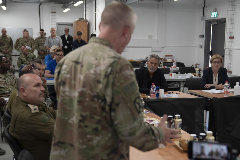 U.S. Agency for International Development Administrator Samantha Power, right, sits next to Muhannad Hadi, U.N. Deputy Special Coordinator for Middle East Peace, center as they attend a meeting with U.S. Army officers and members of the Israeli Army at the Site 61 Israeli military base near Ashdod, Israel, Thursday, July 11, 2024. (AP Photo/Leo Correa)