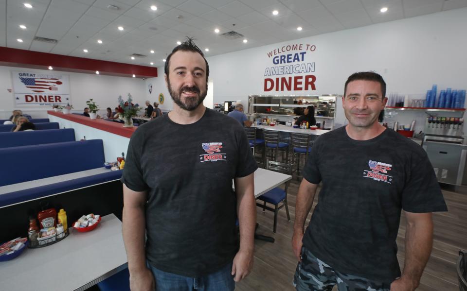 Angelo Valente and Brian OÕReilly, two of the three partners behind the newly opened Great American Diner in Greece. Missing from the photo is Tony DeRosa.