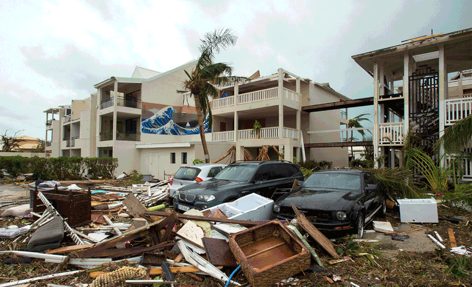 An outside view of Mercure hotel in Marigot on the Bay of Nettle on St. Martin on Sept. 6, after Hurricane Irma, and again on Feb. 28.