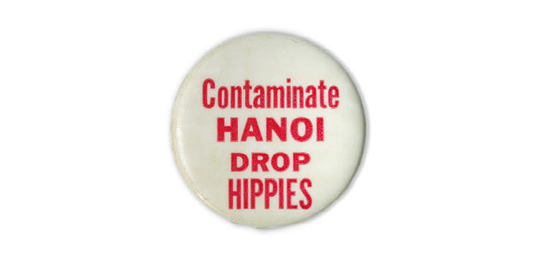 A button reads in red text over a white background: "contaminate Hanoi, drop hippies"