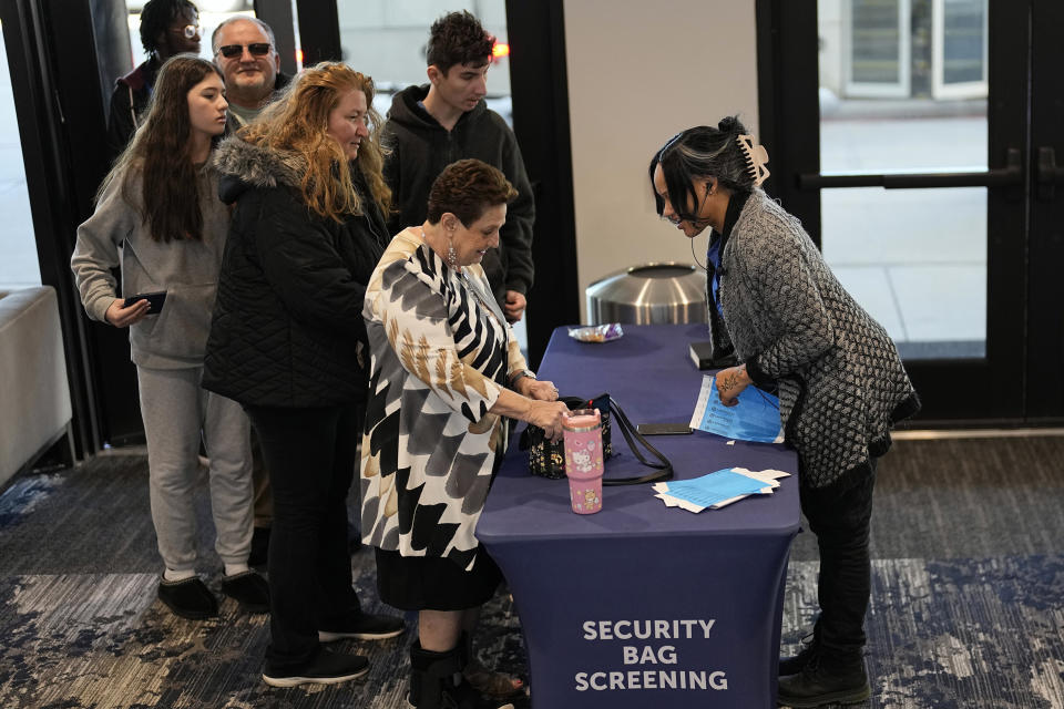 Bags are checked at an entrance inside Lakewood Church, Sunday, Feb. 18, 2024, in Houston. Pastor Joel Osteen welcomed worshippers back to Lakewood Church Sunday for the first time since a woman with an AR-style opened fire in between services at his Texas megachurch last Sunday. (AP Photo/David J. Phillip)