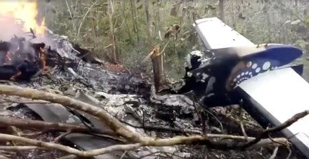 Wreckage in flames after a plane crashed in the mountainous area of Punta Islita, in the province of Guanacaste, in Costa Rica in this still image taken from social media video December 31, 2017. Ministerio de Seguridad Publica de Costa Rica/via REUTERS